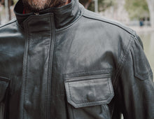 Model wearing the Men's Black Leather Jacket Coat, demonstrating its versatile style.