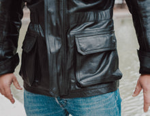 Front pocket detail of the Hunter Black Leather Jacket, highlighting its functional design
