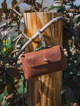 Artisan Leather Dog Accessory – Personalized, eco-friendly waste bag holder, ideal for dog walks and outdoor adventures.