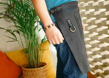 Premium leather apron with a convenient pocket and brass ring, offering a stylish and functional look for workers in restaurants, kitchens, or cafes. Ideal for a personalized or custom engraved apron.