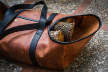Description: Handcrafted leather log carrier designed for transporting firewood. It boasts durable construction and elegant craftsmanship, offering a stylish and practical solution for carrying logs.