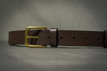 brown leather belt with gold buckle