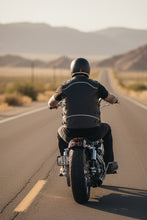 Rear view of black leather biker vest on motorcycle