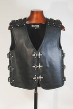 Front view of black leather biker vest with metal buckles