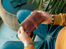 Handcrafted leather tobacco pouch for rolling essentials. Stylish and functional rolling kit with compartments for tobacco, papers, and filters. Perfect gift for smokers, made from premium full-grain leather