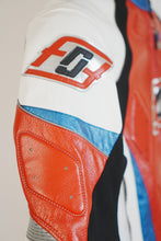 Shoulder padding and stitching detail on red leather racing jacket