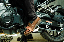 Side view of motorcycle gear shift pad on shoe – protects boots from damage while riding