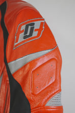 Close-up of Fashion Racing red motorcycle jacket shoulder logo patch and padded design