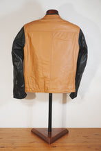 Back view of tan and black leather café racer jacket on mannequin