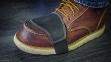Black leather motorcycle gear shift protector on rugged brown work boot – Fashion Racing