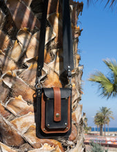 leather phone bag with wide crossbody strap