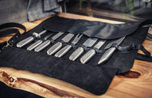 chefs black leather knife roll - Handmade leather chef bag on wooden counter – premium craftsmanship