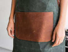 canvas apron with leather straps and pockets