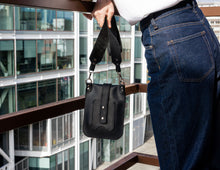 Vertical bag in genuine black leather