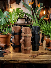 Handcrafted Motorcycle Tool Roll made from genuine leather, displayed in brown, tan, and black color options on a workshop table. Premium leather tool roll with secure buckle closures, reinforced carry handle, and durable construction for organizing motorcycle tools, EDC gear, and maintenance essentials. Compact roll-up tool organizer for bikers, mechanics, adventure riders, and garage storage. Available in multiple leather finishes and ideal as a personalized gift for motorcycle enthusiasts.