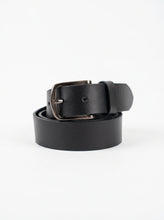 Black metal bracket on a light gray background