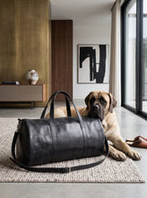 Luxury handcrafted black leather duffle bag for men, front view