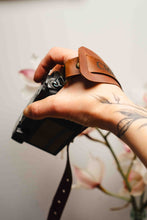 Personalized brown leather camera hand strap with engraved name, handmade photography accessory