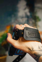 Personalized black leather camera hand strap with initials, handmade accessory for photographers