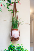 Leather hanging planter styled in a Japandi-inspired home office