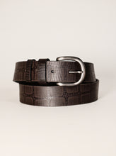 Dark brown croc embossed leather belt on a neutral background