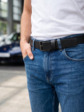 Minimalist black leather belt with classic metal buckle for men