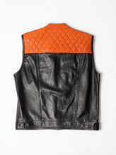 A black leather vest with a quilted orange yoke across the upper back, shown from the back on a white background.