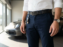 Black full-grain leather belt with perforated design and silver buckle for casual wear