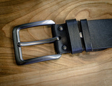 Black leather belt with close-up view of buckle, fastening loops, and smooth strap construction