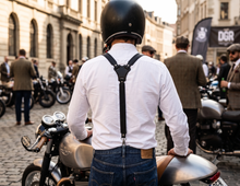 Black reinforced leather suspenders worn with a white shirt