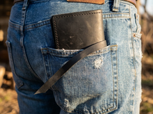 Handmade black leather tobacco pouch with rolling paper holder and long leather strap