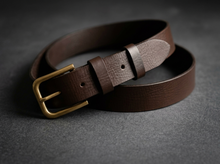 Brown full-grain leather belt with antique brass buckle and adjustable fastening