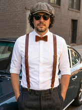 Brown leather suspenders for men with adjustable straps and brass hardware, ideal for weddings and groomsmen.