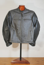 Front view of grey and black café racer motorcycle jacket on mannequin