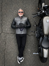 Custom grey leather motorcycle jacket with minimalist cafe racer styling for men