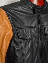 Close-up of a black tan leather jacket a mannequin.