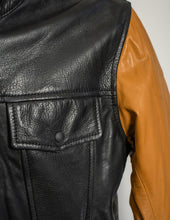 Close-up of a black leather jacket with a brown sleeve on a white background