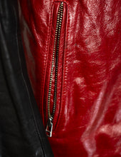 Close-up of a red leather jacket with a zipper