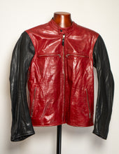 Red and black leather jacket on a mannequin against a white background