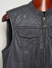 Grey leather vest on a mannequin with a white background