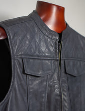 Gray leather vest on a mannequin with a plain background