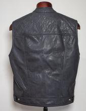 Black leather vest on a mannequin against a white background