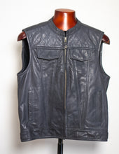 Black leather vest on a mannequin against a white background