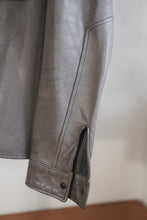 Sleeve and cuff detail of handmade gray leather jacket