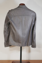 Back view of men’s gray leather shirt jacket