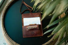 A brown leather tobacco pouch