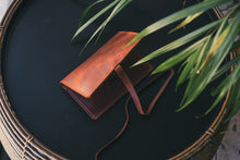 Handmade brown leather tobacco pouch, compact rolling tobacco case with long leather strap.