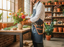 leather tool belt pocket stands garden center, arranging a colorful bouquet of flowers on a wooden table.