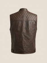 Brown leather vest with quilted back on a beige background