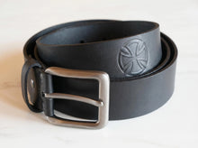 Black genuine leather men's belt with a matte silver metal buckle and embossed logo. Premium handcrafted leather belt for casual, business, and everyday wear.